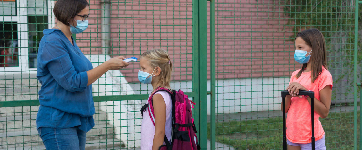 School nurse scanning students for temperatures during COVID-19 pandemic