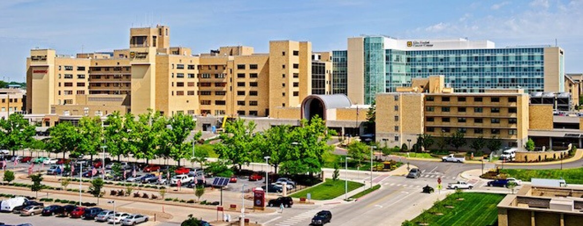 Image of a large hospital and its parking lot