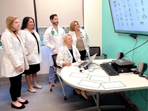 group of medical professionals review digital information