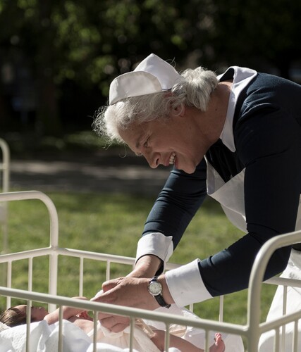 An actor, seen here, is portraying a nurse caring for a child diagnosed with jaundice.