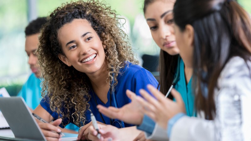 group of smiling female nursing students
