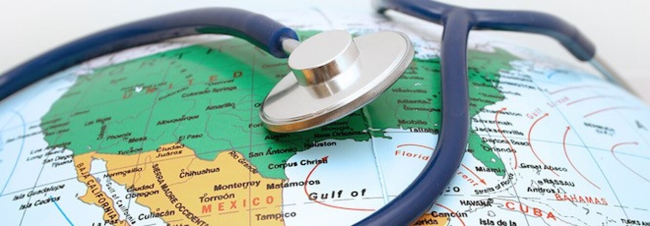 Stethoscope on top of a globe