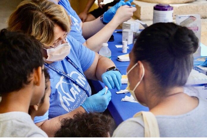 NAHN nurse with patients at clinic